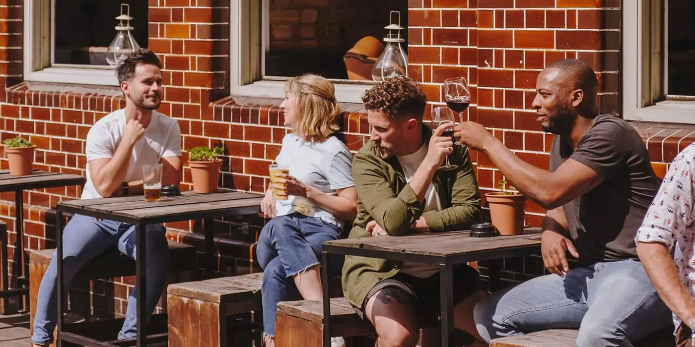 Restaurant customers sitting at a table outdoor